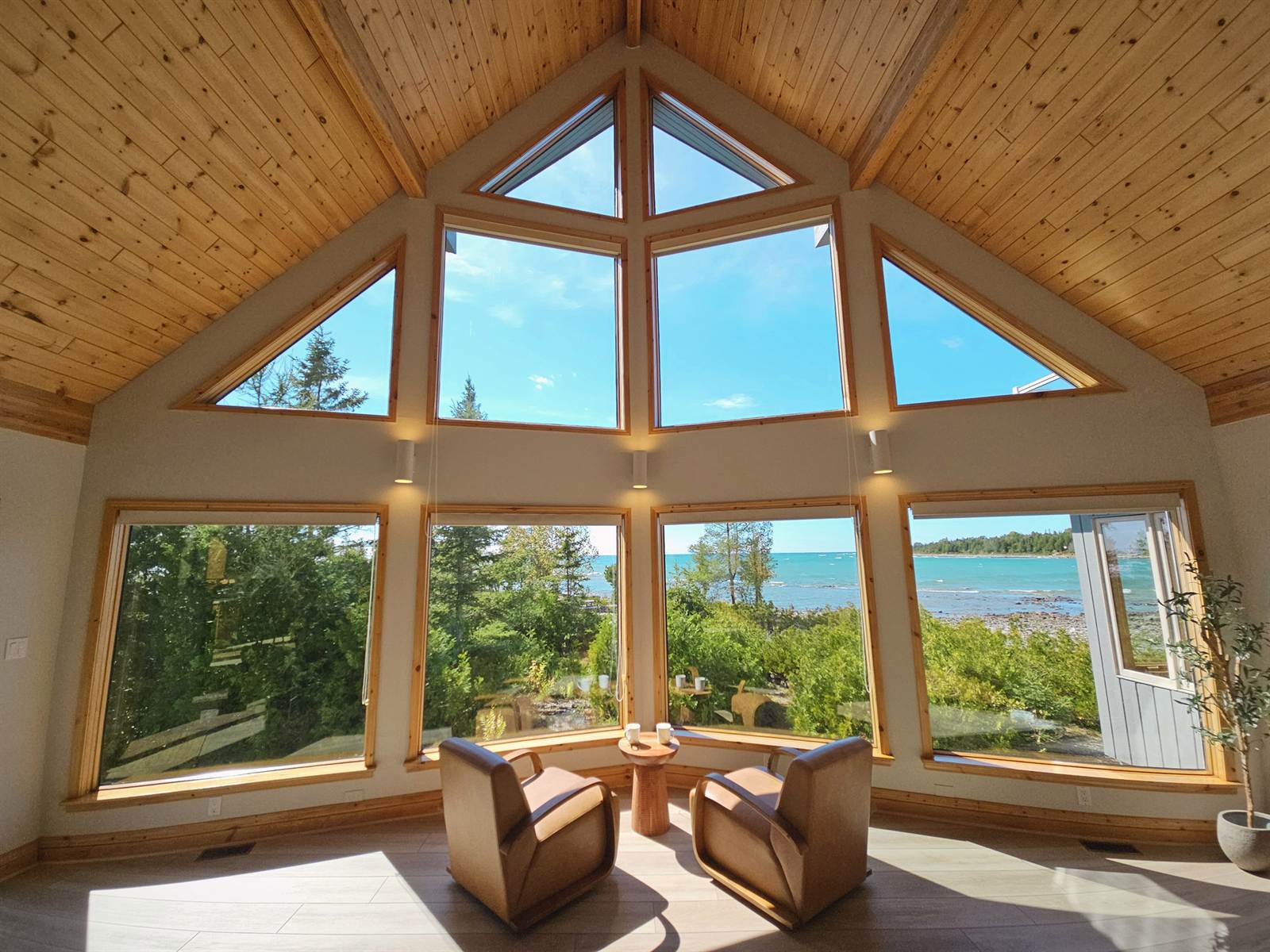 Cathedral window wall in the great room framing Lake Huron